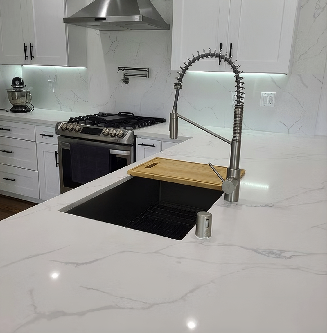 Luxury kitchen remodel with marble waterfall countertops