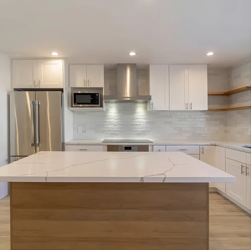Open concept kitchen with waterfall island and custom cabinetry