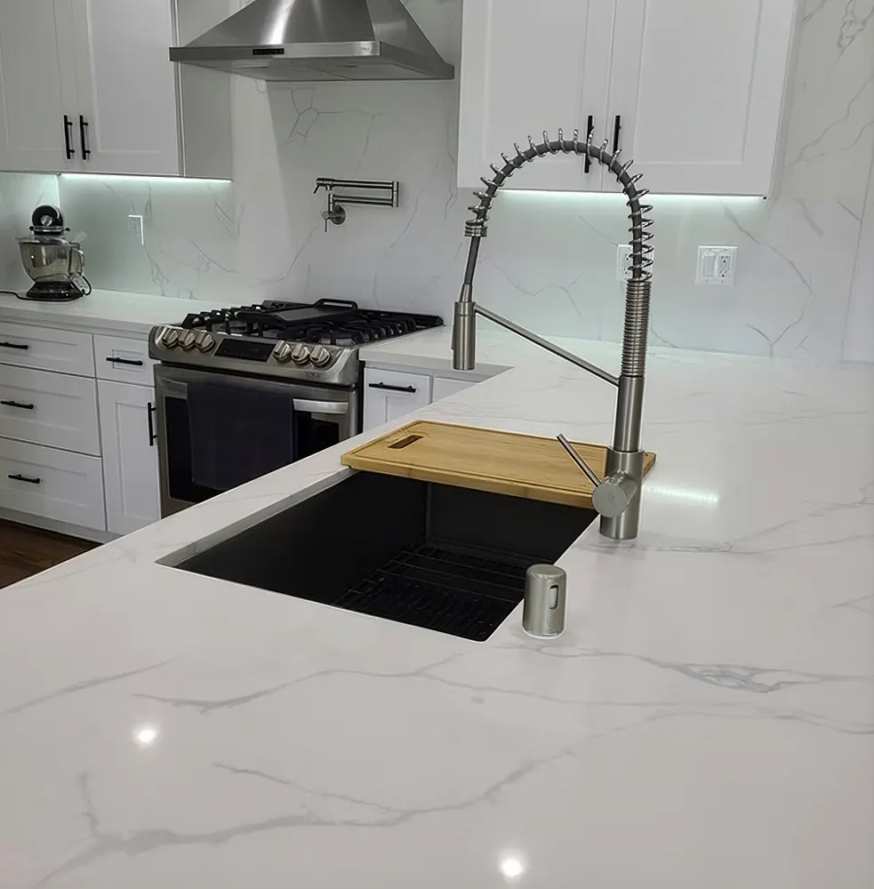 Luxury kitchen remodel with marble waterfall countertops